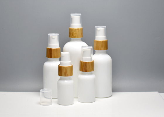 China Glass Skin Essence Oil Packaging Opal White Glass Bottles With Bamboo Pump Spray, Glass Primary Cosmetic Containers supplier