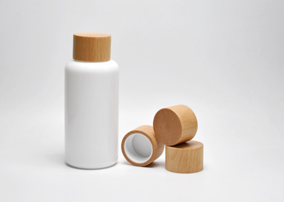 China Sustainable 100ml Boston Round Opal White Glass Lotion Bottles With Wooden Screw Cap, Primary Cosmeceutical Packaging supplier