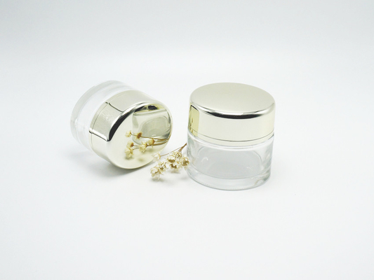 China JG-T32, 30&amp;50ml unique oval clear glass skin care jars with lids, customized empty glass jar packaging manufacture supplier
