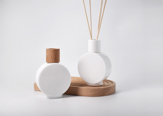 China 100ml clock shape glass reed diffuser bottle, 100% recyclable flint or opal glass, equipped with various screw-on caps supplier